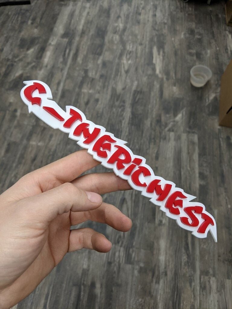 C_Le badge de la voiture la plus riche - Rouge sur blanc - Police Ninja