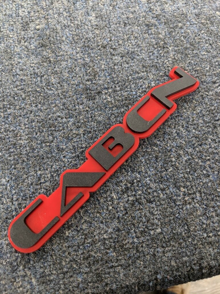 Cabcn Car Badge - Matte Black On Red - OEM Font - Atomic Car Concepts