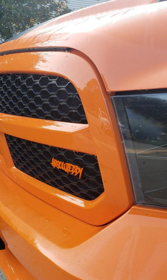 AbsoluteEddy Car Badge - Orange on Matte Black - Aggressive Font - Atomic Car Concepts