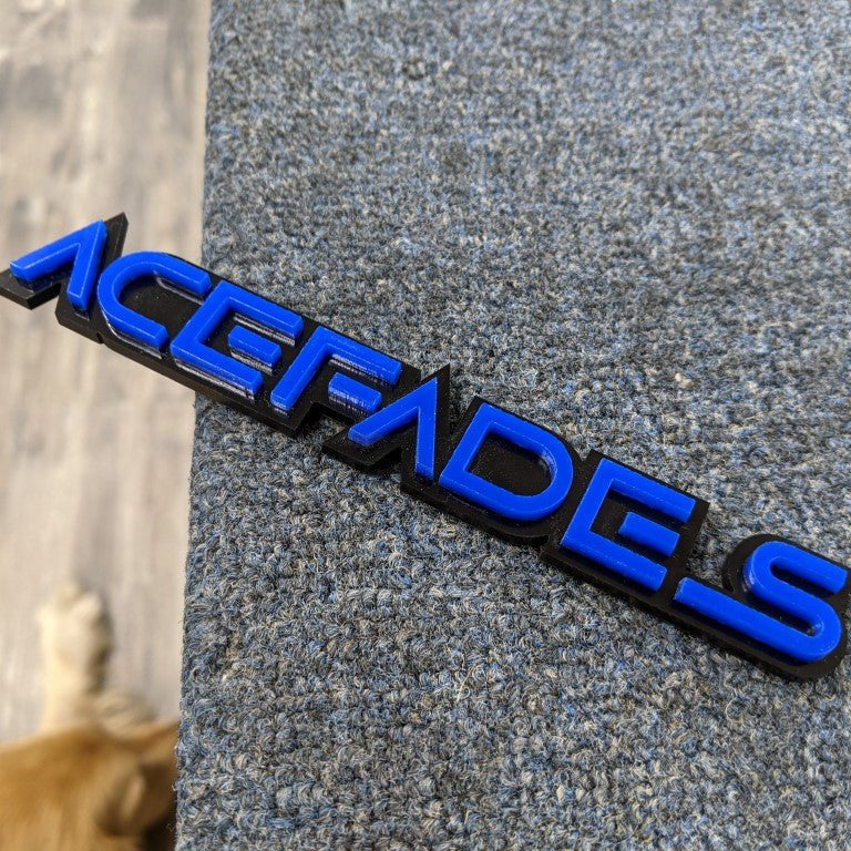 Acefades Car Badge - Blue On Gloss Black - Squid Font - Tape Mount - Atomic Car Concepts