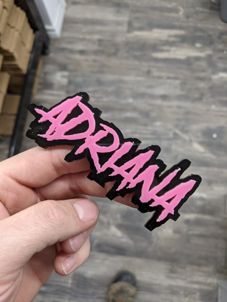 Adriana Car Badge - Pink On Gloss Black - Aggressive Font - Atomic Car Concepts