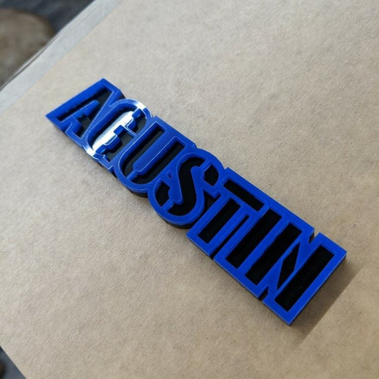 Agustin Car Badge - Blue On Gloss Black - Stencil Font - Tape Mount - Atomic Car Concepts