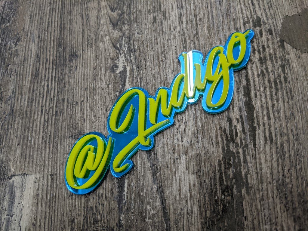 @Indigo Car Badge - Yellow On Mirror Blue - Script Font - Atomic Car Concepts