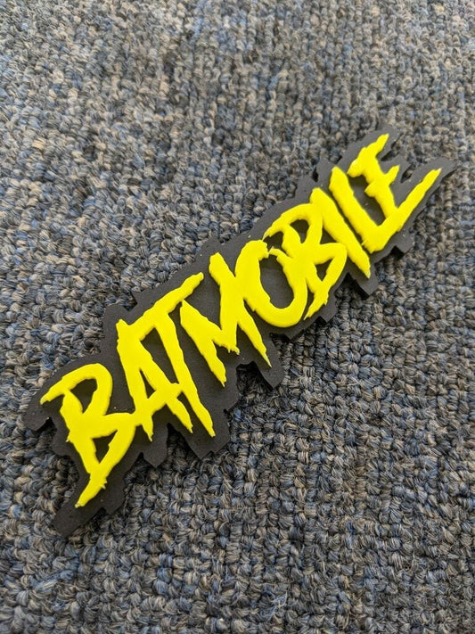 Batmobile Car Badge - Yellow On Matte Black - Aggressive Font - Atomic Car Concepts