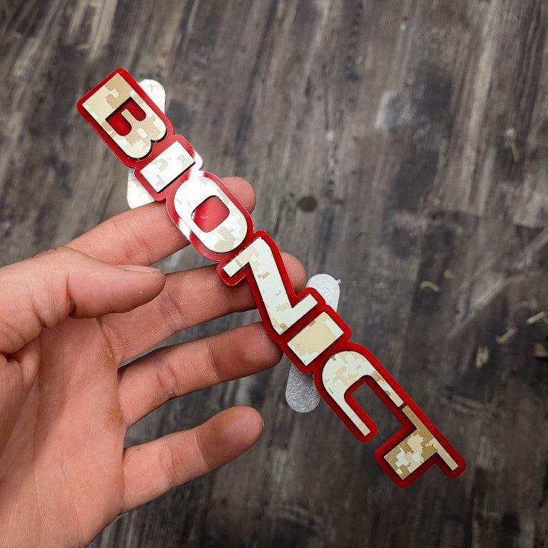 Bionict Car Badge - Camo on Red - OEM Font - Atomic Car Concepts