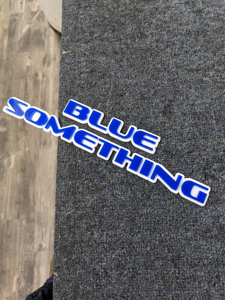 Blue Something Car Badge - Blue On White - OEM Font - Atomic Car Concepts