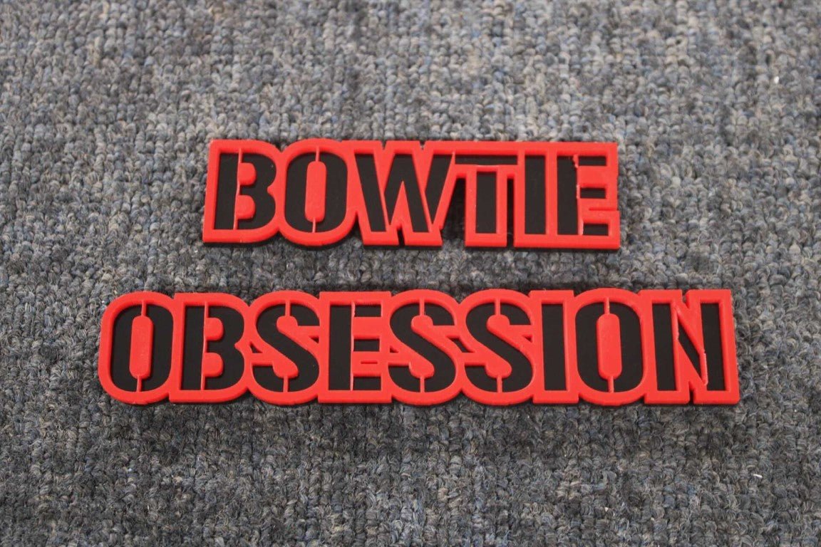 Bowtie Obsession Car Badge - Red On Matte Black - Stencil Font - Tape Mount - Atomic Car Concepts