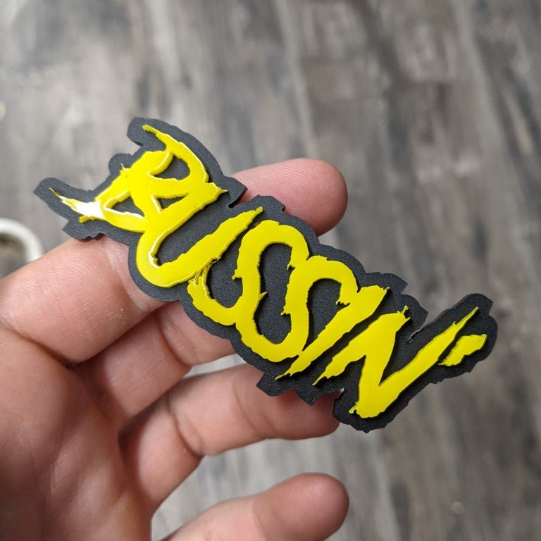 Bussin Car Badge - Mirror Yellow On Matte Black - Aggressive Font