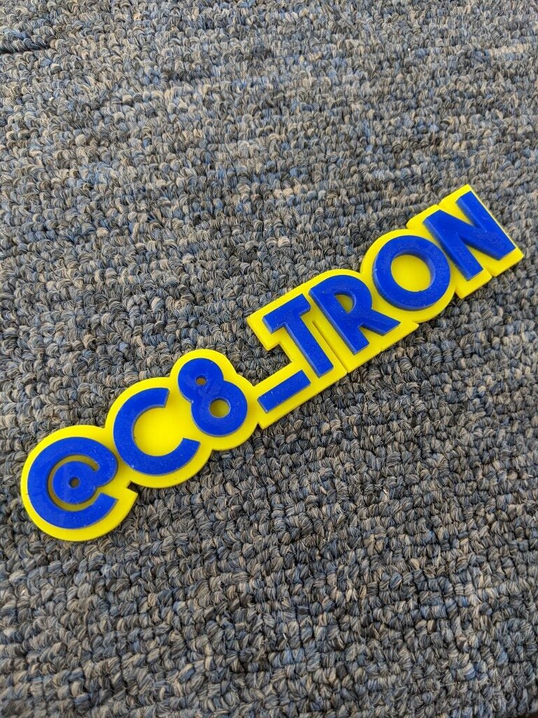 C8_Tron Car Badge - Blue On Yellow - Block Font - Atomic Car Concepts