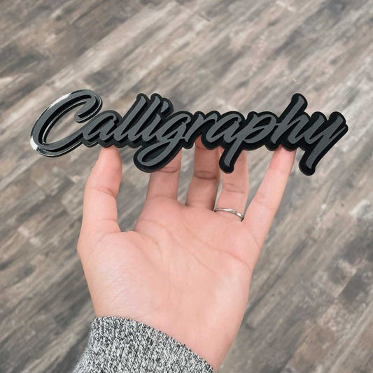 Calligraphy Car Badge - Matte Black On Gloss Black - Script Font - Atomic Car Concepts