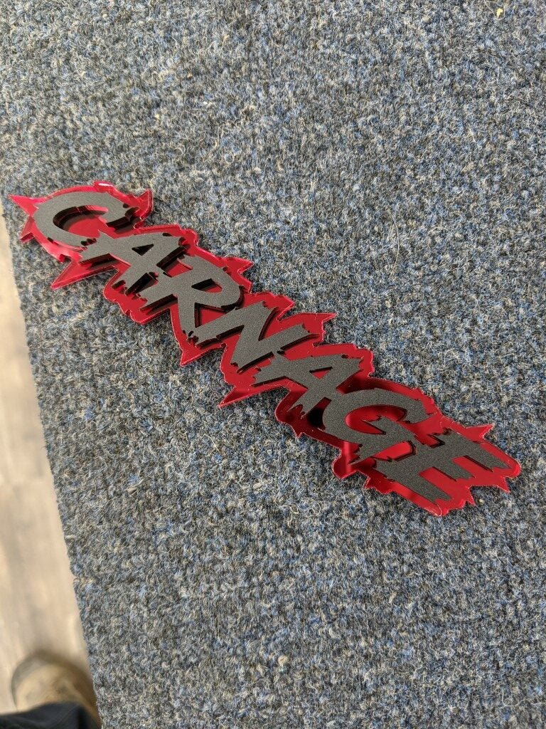 Carnage Car Badge - Matte Black On Mirror Red - Lightning Font - Atomic Car Concepts