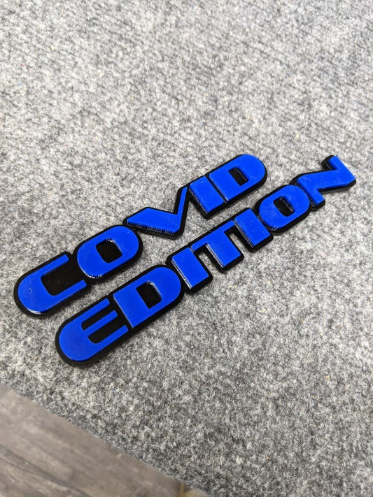 Covid Edition Car Badge - Blue On Gloss Black - OEM Font - Atomic Car Concepts