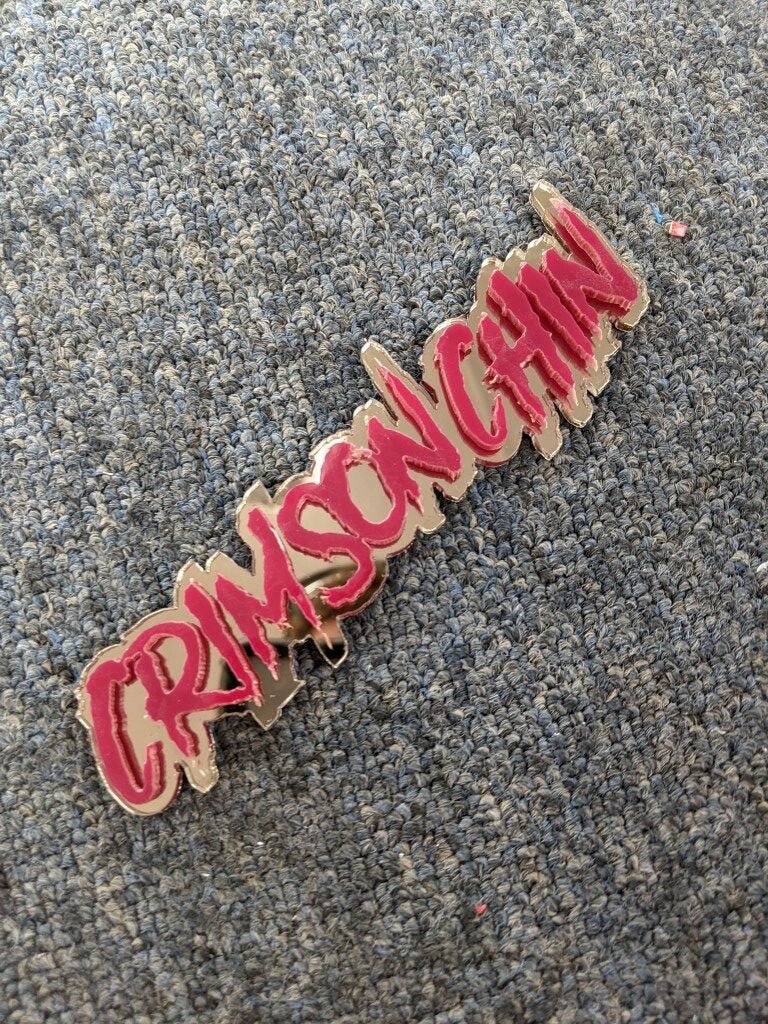 Crimson Chin Car Badge - Red On Mirror Bronze - Aggressive Font - Atomic Car Concepts