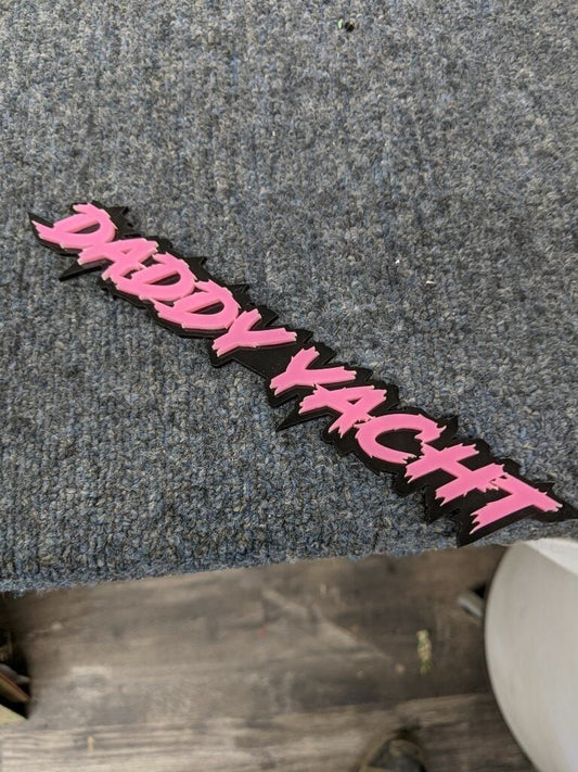 Daddy Yacht Car Badge - Pink On Gloss Black - Lightning Font