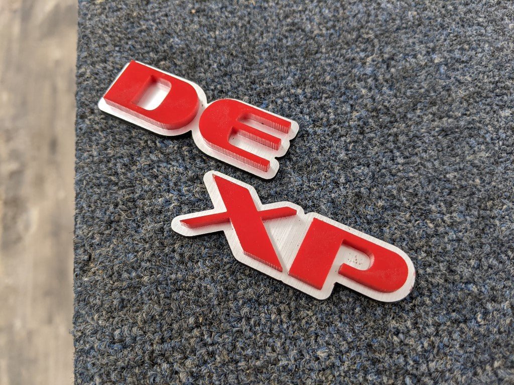 DE XP Car Badge - Red On White - OEM Font - Atomic Car Concepts