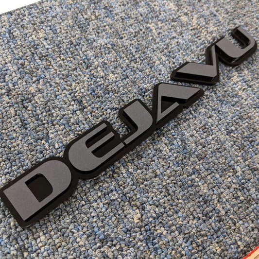 Dejavu Car Badge - Matte Black On Gloss Black - OEM Font