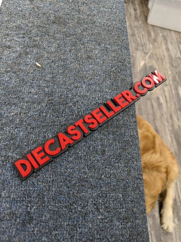 Die Cast Seller.com Car Badge - Red On Matte Black - Block Font - Atomic Car Concepts