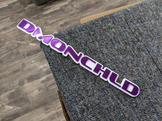 Dmonchld Car Badge - Mirror Purple On White - OEM Font - Atomic Car Concepts