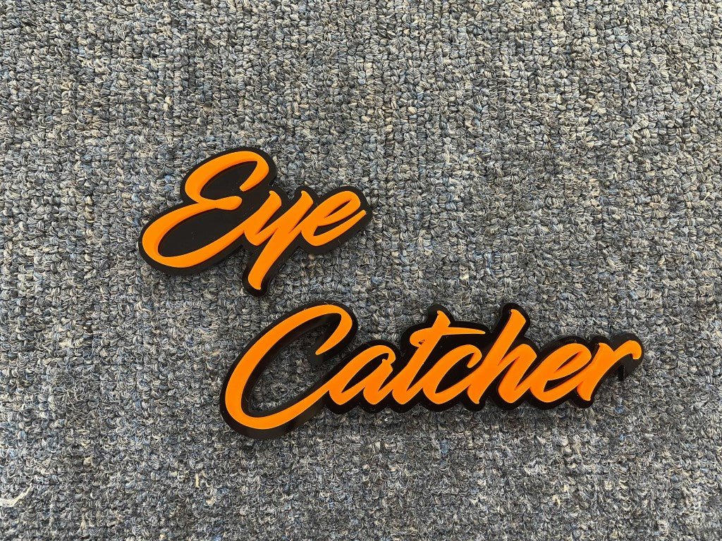 Eye Catcher Car Badge - Orange On Gloss Black - Script Font - Atomic Car Concepts