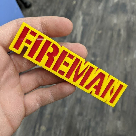 Fireman Car Badge - Yellow On Red - Stencil Font - Tape Mount