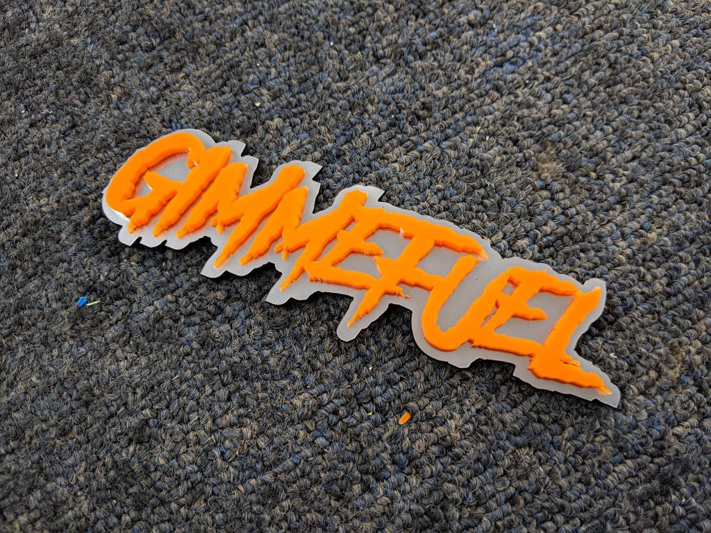 Gimmefuel Car Badge - Orange on Brushed Silver - Aggressive Font - Tape Mounting