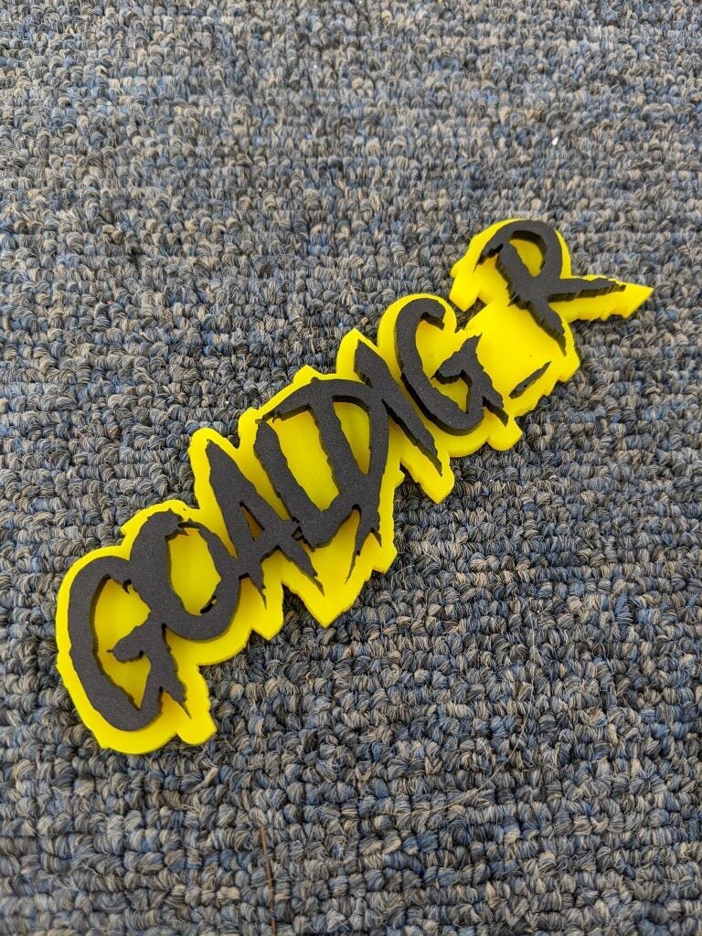 Goaldig_r Car Badge - Matte Black On Yellow - Aggressive Font - Atomic Car Concepts