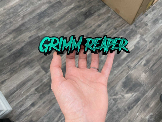 Grimm Reaper Car Badge - Mirror Green On Gloss Black - Aggressive Font - Atomic Car Concepts