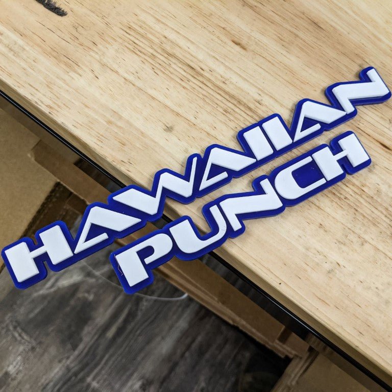 Insignia de coche Hawaiian Punch - Blanco sobre azul - Fuente OEM - Montaje en cinta