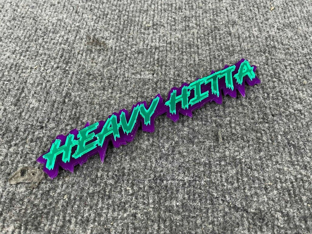 Heavy Hitta Car Badge - Mirror Green On Purple - Lightning Font