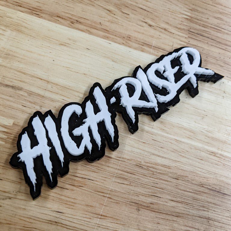 High-Riser Car Badge - White on Gloss Black - Aggressive Font - Tape Mounting - Atomic Car Concepts