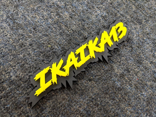 Ikaika13 Car Badge - Yellow on Matte Black - Lightning Font - Tape Mounting - Atomic Car Concepts