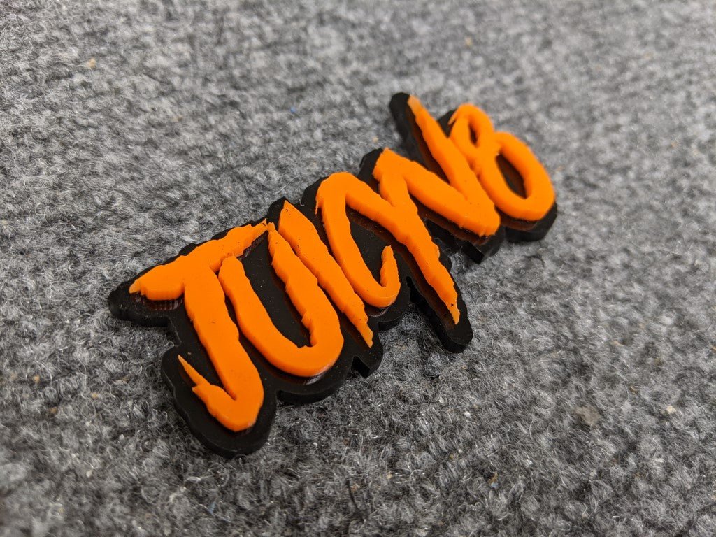 JuicyV8 Car Badge - Orange on Gloss Black - Aggressive Font - Atomic Car Concepts