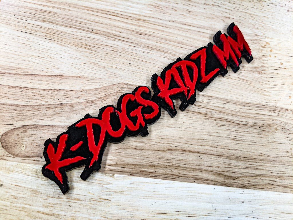 K-Dogs Kidz MM Car Badge - Red on Gloss Black - Aggressive Font - Tape Mounting - Atomic Car Concepts