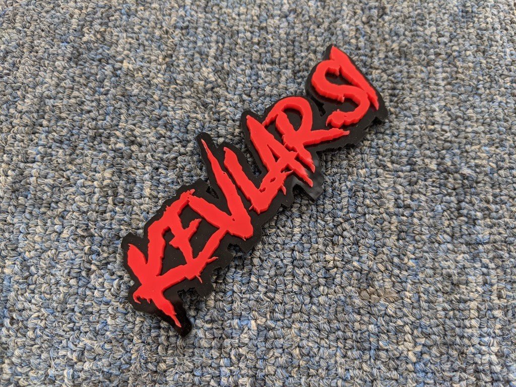 Kevlar Si Car Badge - Red on Gloss Black - Aggressive Font- Tape Mounting - Atomic Car Concepts