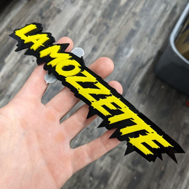 La Mozzette Car Badge - Yellow on Gloss Black - Lightning Font - Tape Mounting - Atomic Car Concepts