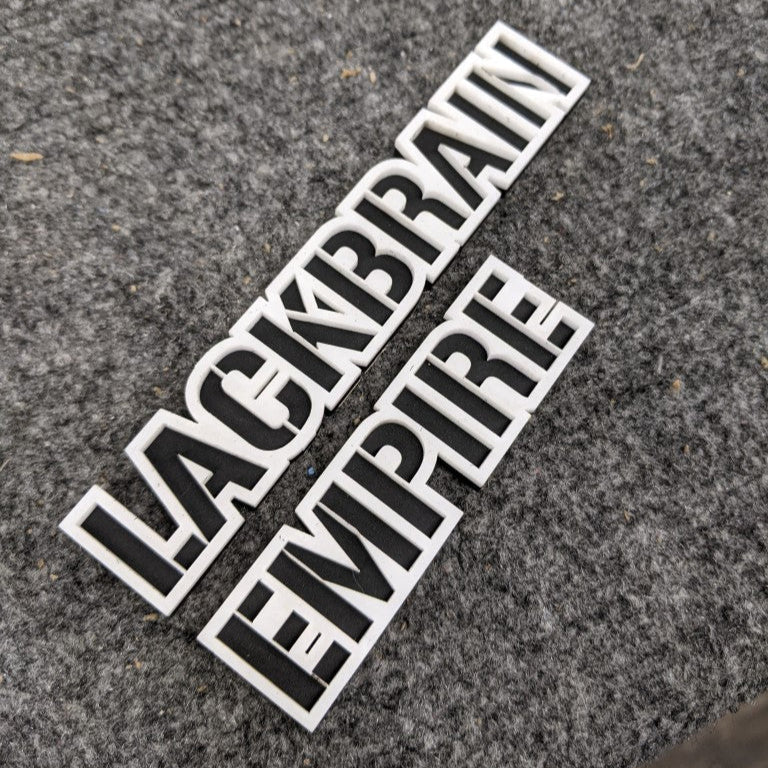 Lackbrain Empire Car Badge - White On Gloss Black - Stencil Font - Tape Mount - Atomic Car Concepts