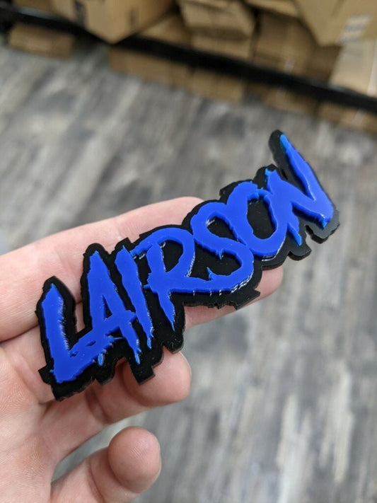 Lairson Car Badge - Blue On Gloss Black - Aggressive Font - Atomic Car Concepts