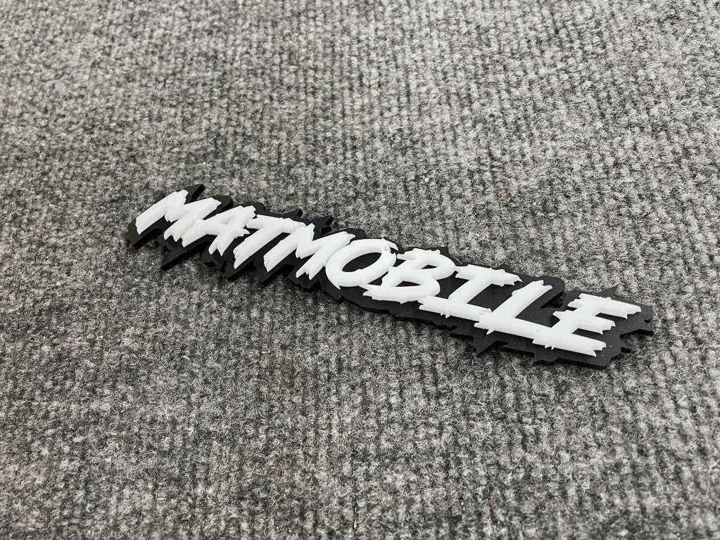 Matmobile Car Badge - White On Gloss Black - Lightning Font - Atomic Car Concepts