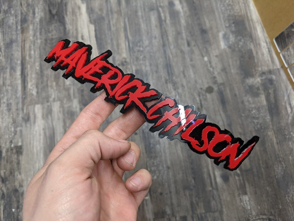 Maverick Chilson Car Badge - Red on Gloss Black - Aggressive Font - Tape Mounting - Atomic Car Concepts