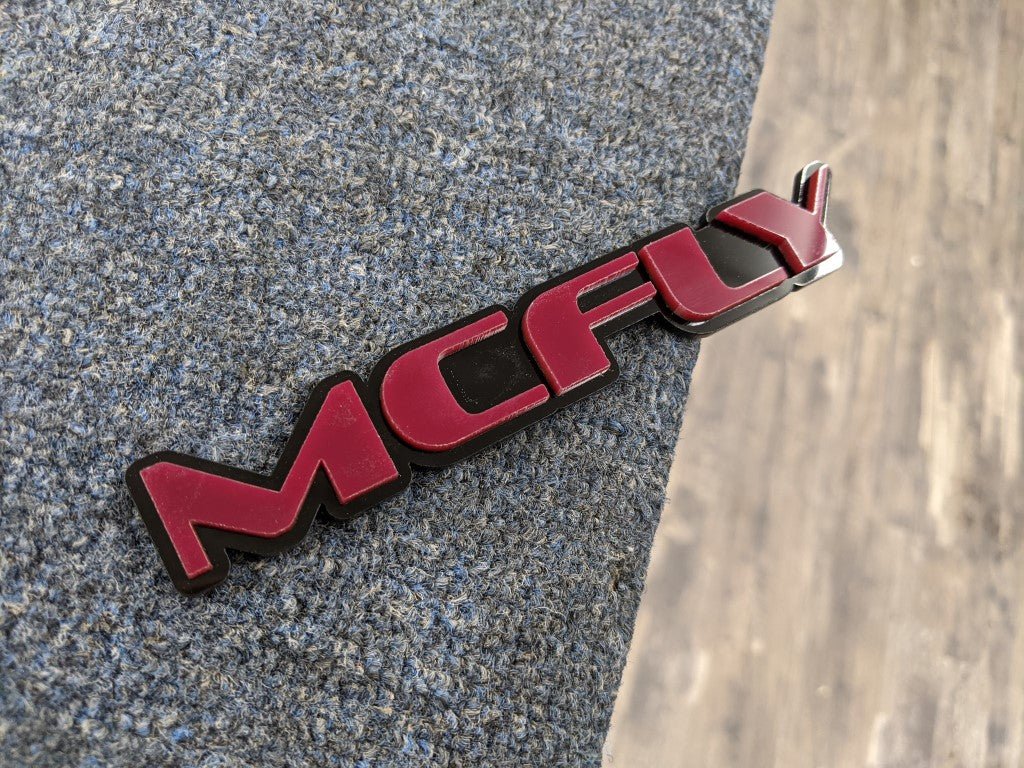 McFly Car Badge - Mirror Red On Gloss Black - OEM Font - Atomic Car Concepts