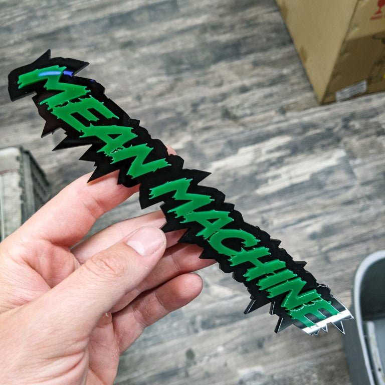 Mean Machine Car Badge - Green on Gloss Black - Lightning Font - Tape Mounting - Atomic Car Concepts