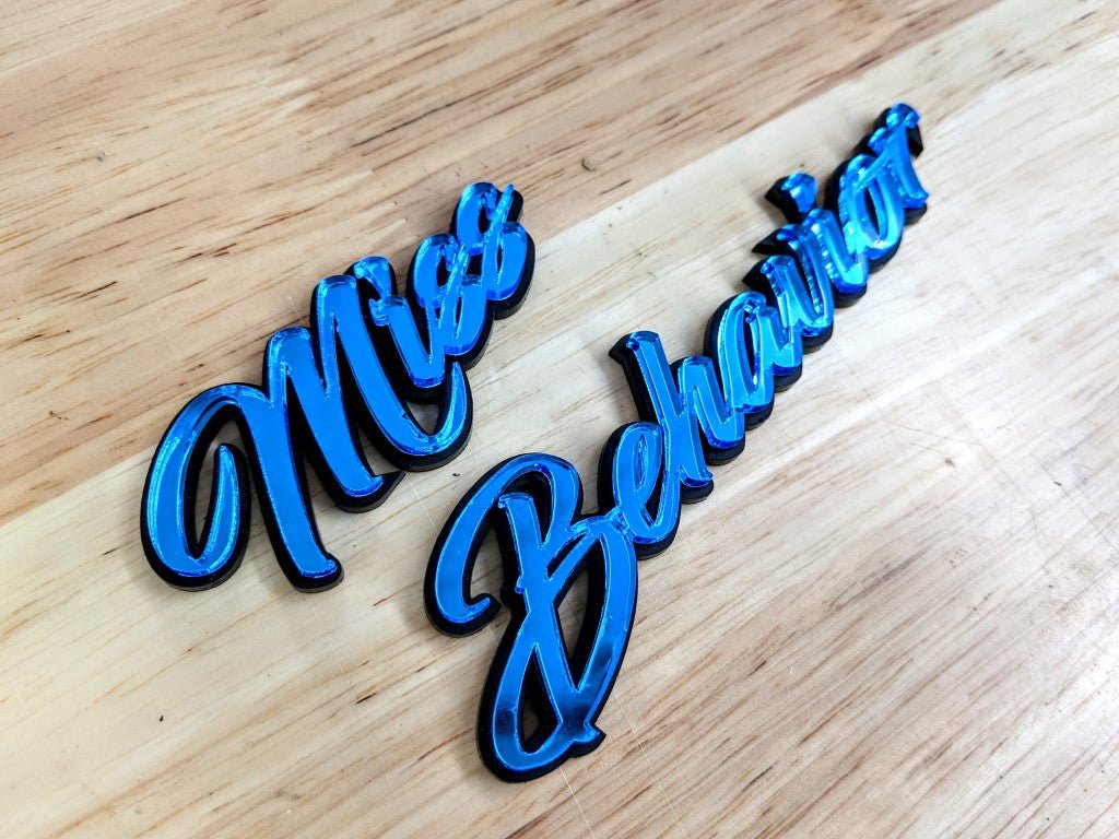 Miss Behavior Car Badge - Mirror Blue On Gloss Black - Script Font - Atomic Car Concepts