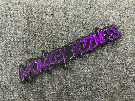 Monkey Bizzness Car Badge - Mirror Purple On Gloss Black - Aggressive Font - Atomic Car Concepts