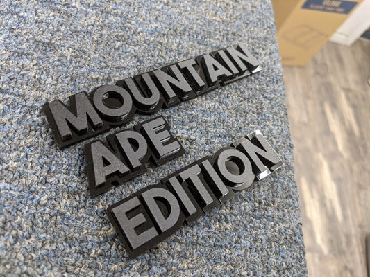 Mountain Ape Edition Car Badge - Matte Black On Gloss Black - Block Font - Atomic Car Concepts