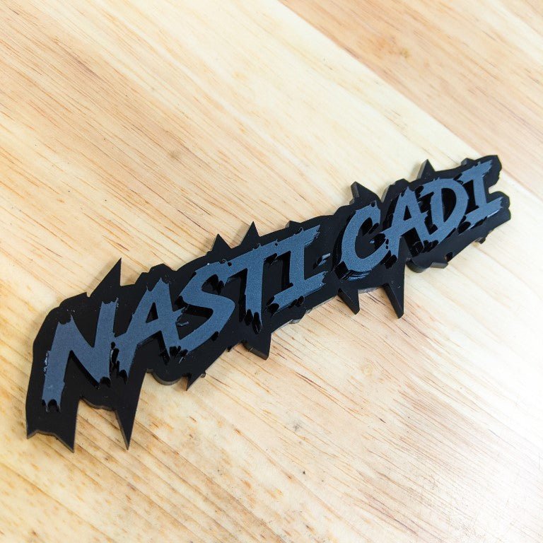 Nasti Cadi Car Badge - Matte Black on Gloss Black - Lightning Font - Tape Mounting - Atomic Car Concepts