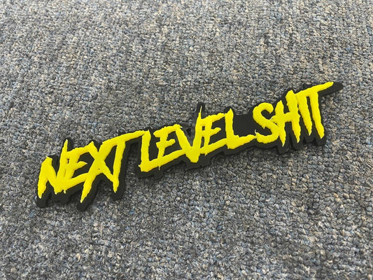 Next Level Shit Car Badge - Yellow On Gloss Black - Aggressive Font - Atomic Car Concepts