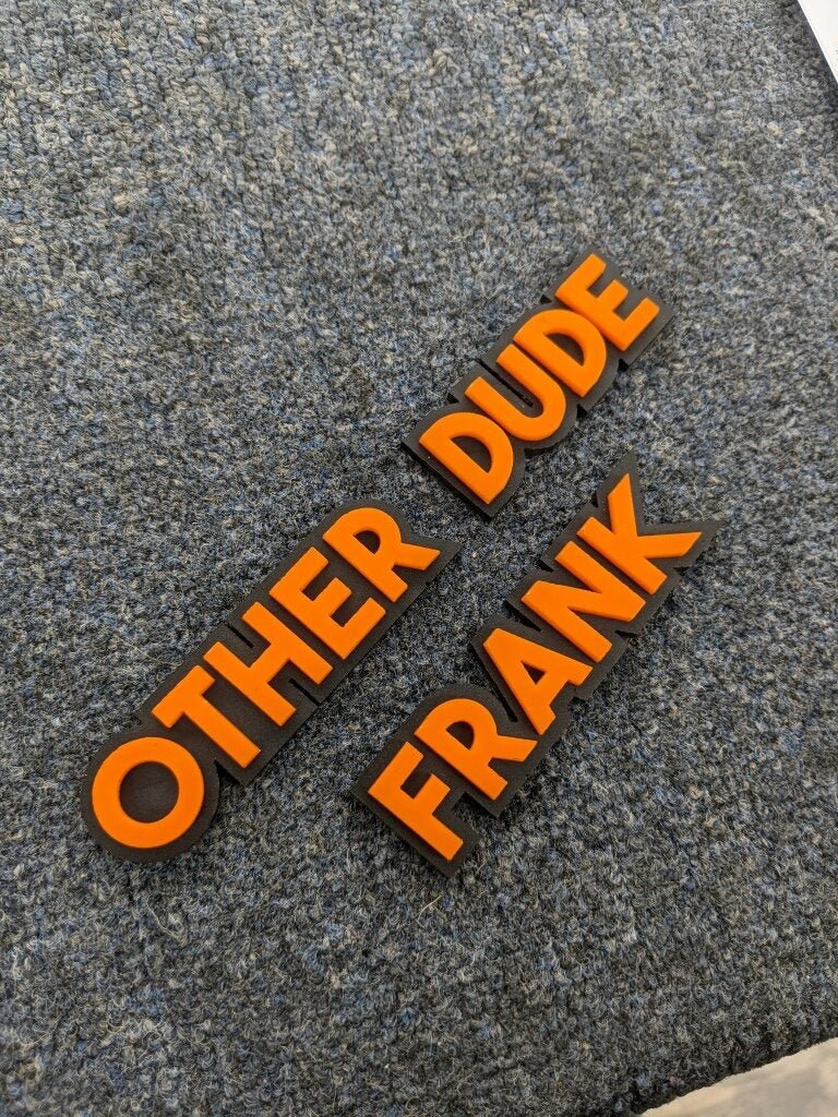 Other Dude Frank Car Badge - Orange On Matte Black - Block Font - Atomic Car Concepts