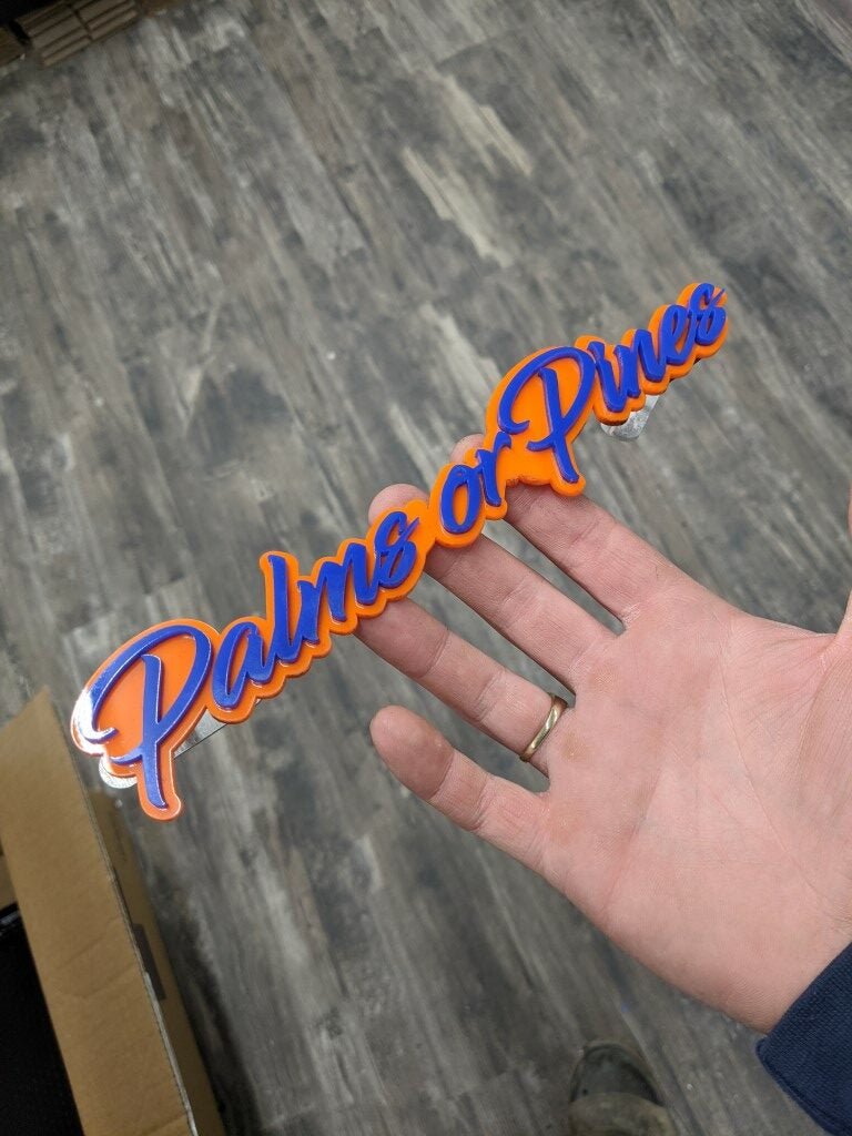 Palms Or Pines Car Badge - Blue On Orange - Script Font - Atomic Car Concepts