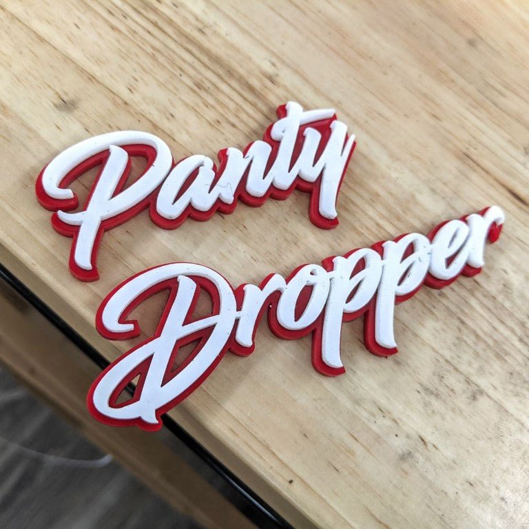 Panty Dropper Car Badge - White on Red - Script Font - Tape Mounting - Atomic Car Concepts