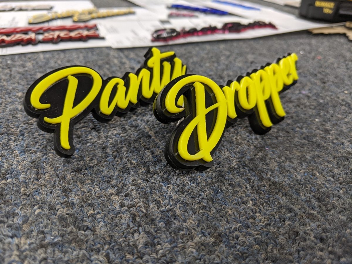 Panty Dropper Car Badge - Yellow on Gloss Black - Script Fond - Atomic Car Concepts